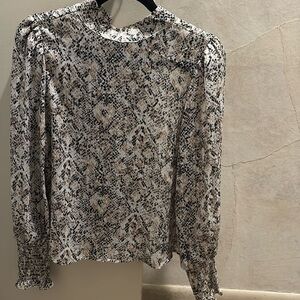 Snakeskin print top, metallic threading, puff shoulder and smocked wrists